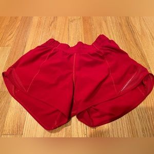 Bright red Lululemon hotty hot shorts 4 inch size 4